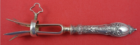 Bone Holder w/ figural handle and plated implement for cutlets 4 1/4